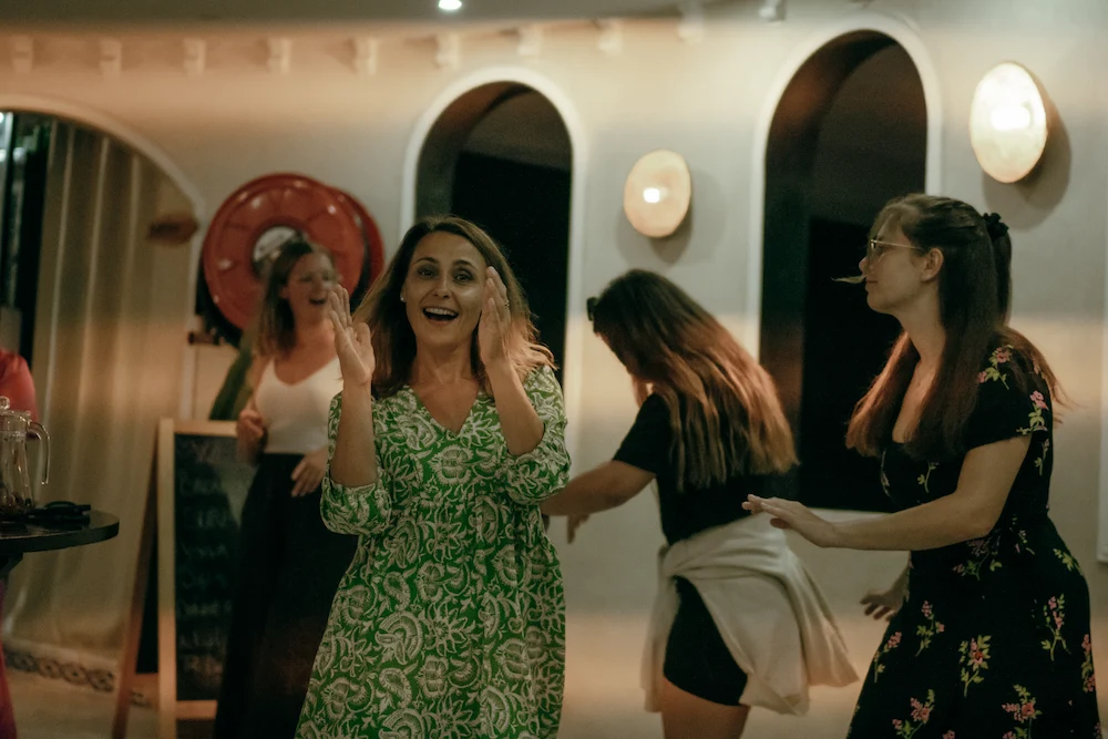 Happy Guests Dancing at Villa Party at The Yogi Surfer in Taghazout Bay, Morocco.