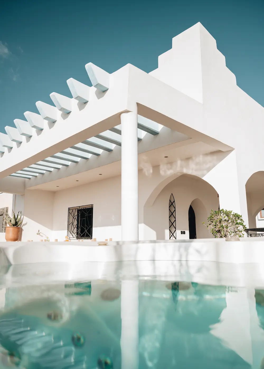 Jacuzzi Water View on White Villa Terrace at The Yogi Surfer in Taghazout Bay, Morocco.