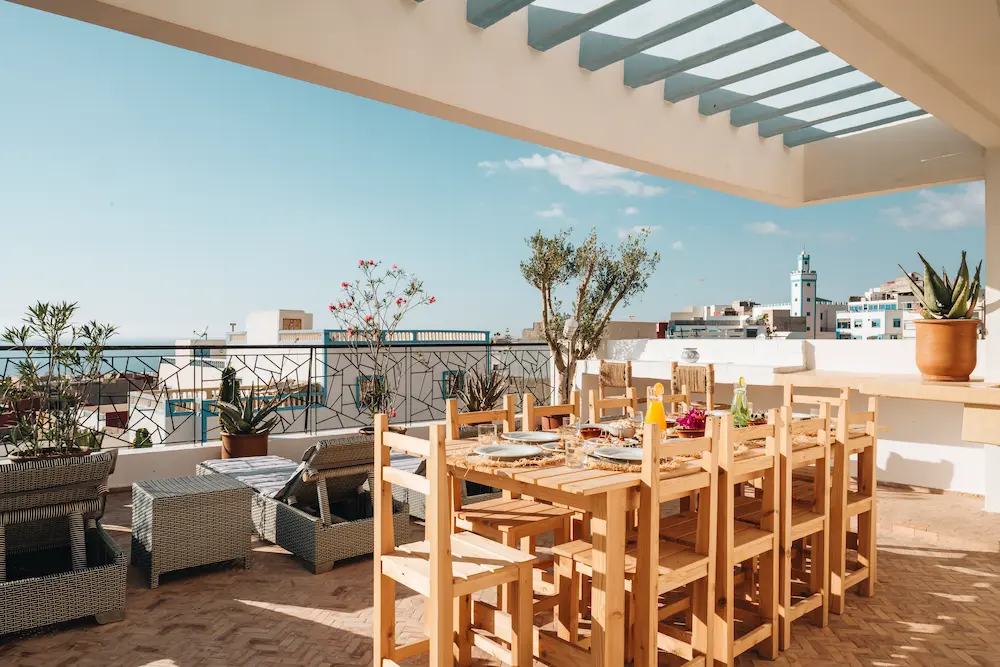 Rooftop Terrace Dining with City View in Morocco at The Yogi Surfer in Taghazout Bay, Morocco.