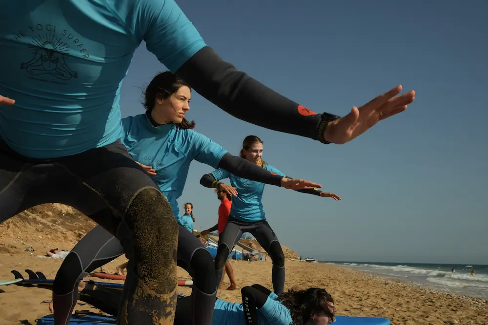Students Learn to Surf - Surf House Taghazout at The Yogi Surfer in Taghazout Bay, Morocco.